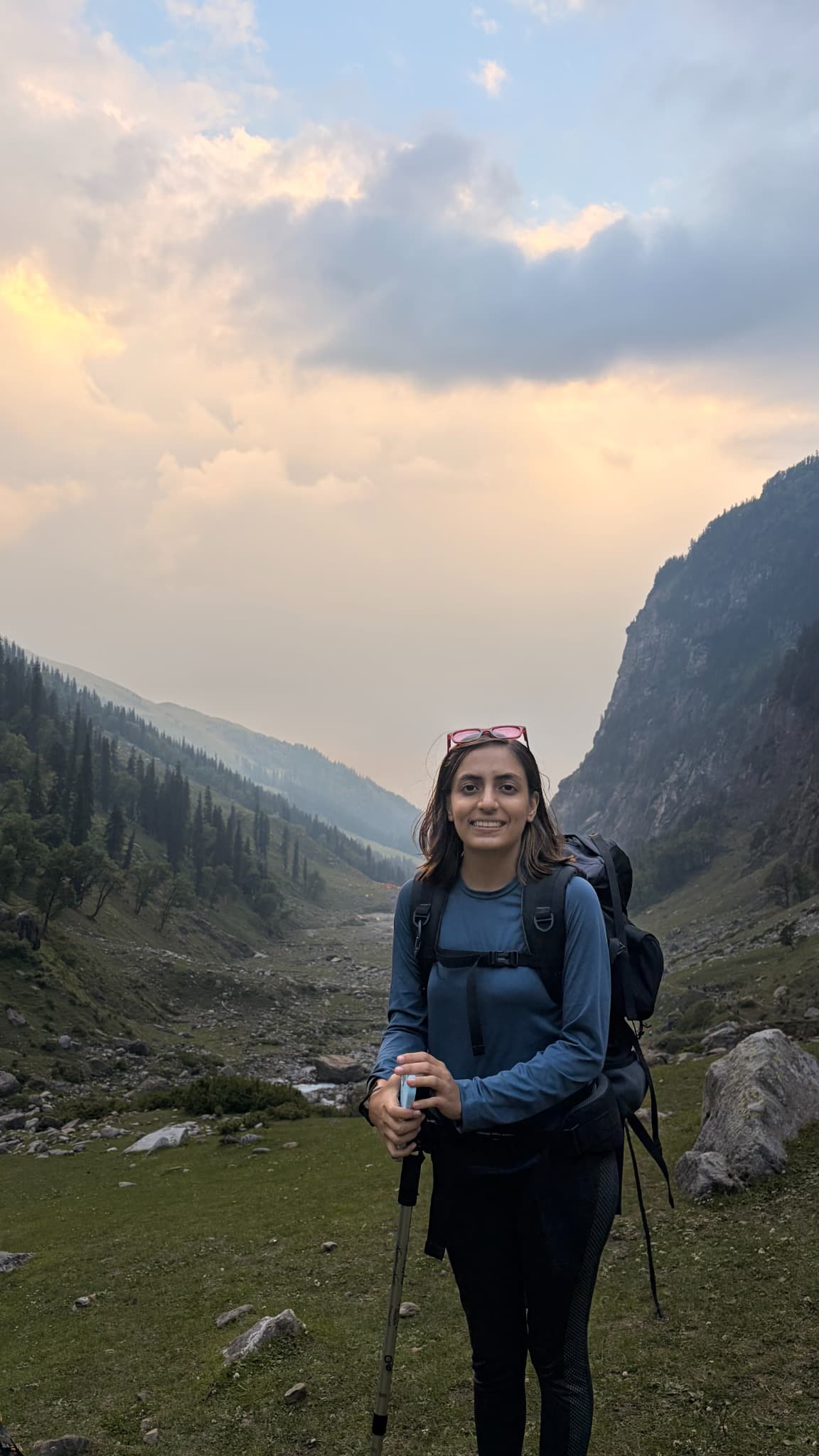 Sanskruti hiking in a Himalayan valley at sunset